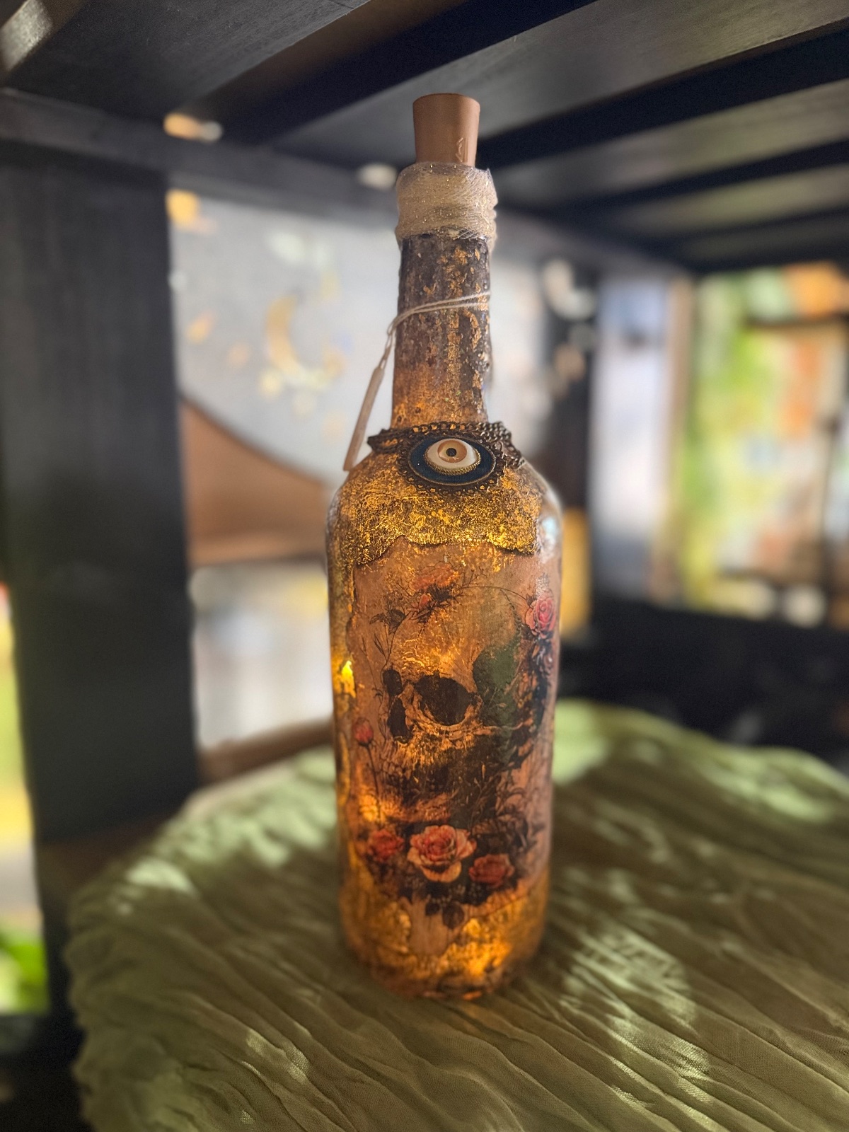 Light up Skull/Rose bottle with evil eye accent