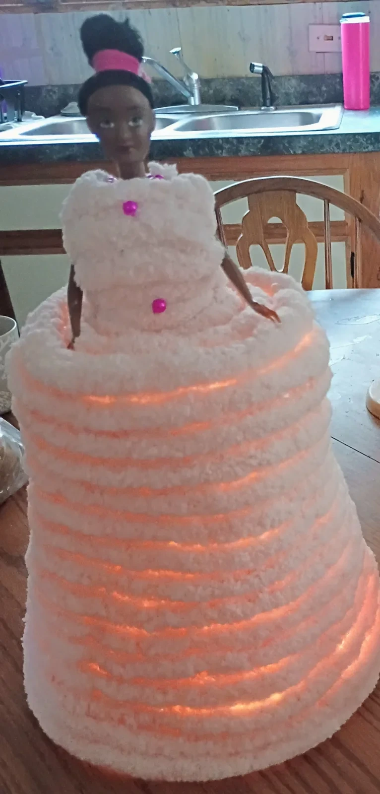 Handmade light-up Barbie basket with a push-light base, pink dress, pearl accents, and a Barbie headband..,
